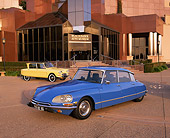 AUT 23 RK0343 08
1970 Citroen DS 21 Blue 1963 Citroen Ami Yellow On Pavement By Museum