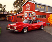 AUT 23 RK0379 01
1972 Mercury Montego GT 429 Red With Flames 3/4 Front View By Barn