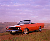 AUT 23 RK0575 02
1970 Plymouth Road Runner Convertible Orange And White 3/4 Front View On Grass Hill