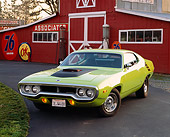 AUT 23 RK0395 03
1972 Plymouth Road Runner Lime Green 3/4 Front View On Pavement By Barn