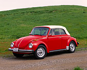 AUT 23 RK0404 02
1979 Volkswagen Convertible Bug Red 3/4 Side View On Dirt By Grass Hill