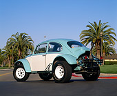 AUT 23 RK0410 05
1970 VW Baja Bug Light Blue And White 3/4 Rear View On Pavement By Palm Trees Blue Sky