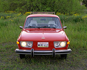 AUT 23 RK0414 01
1974 VW 412 Estate Wagon Red Head On Shot On Grass By Yellow Flowers