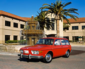 AUT 23 RK0415 02
1974 VW 412 Estate Wagon Red Front 3/4 Front View On By Water Fountain