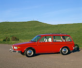 AUT 23 RK0416 01
1974 VW 412 Estate Wagon Red Side 3/4 View On Pavement By Grass Hills Blue Sky