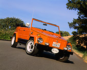AUT 23 RK0445 01
1973 Volkswagen Thing Type 181 Orange Slanted 3/4 Front View On Pavement By Trees
