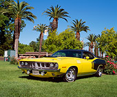 AUT 23 RK0460 03
1971 Plymouth 'Cuda 440 Yellow And Black Low 3/4 Front View On Grass By Trees
