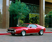 AUT 23 RK0467 01
1971 AMC Javelin SST Red With Black Stripe 3/4 Front View By Building