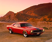 AUT 23 RK0528 04
1971 Dodge Challenger 426 Hemi Red And Black 3/4 Front View On Sand By Rocks