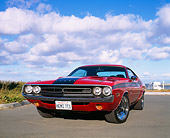 AUT 23 RK0532 01
1971 Dodge Challenger 426 Hemi Red And Black Low 3/4 Front View On Pavement Cloudy Blue Sky