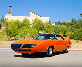 AUT 23 RK0615 01
1970 Plymouth Superbird Orange Low 3/4 Front View On Pavement By Building And Trees