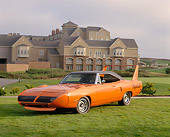 AUT 23 RK0626 01
1970 Plymouth Superbird Orange 3/4 Front View On Grass By Building