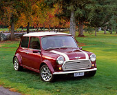 AUT 23 RK0656 03
1972 Canadian Austin Mini 1000 Burgundy White Stripe Front 3/4 View On Grass