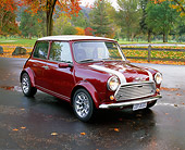 AUT 23 RK0657 02
1972 Austin Mini 1000 Burgundy With White Stripe Front 3/4 View On Pavement