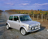 AUT 23 RK0666 05
1971 Austin Mini Cooper Silver 3/4 Side View On Gravel By Vineyard
