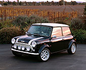 AUT 23 RK0674 02
1971 Morris Mini Cooper Black And Silver 3/4 Front View On Pavement By Field