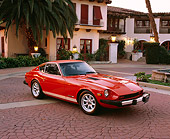 AUT 23 RK0691 02
1978 Datsun 280Z Orange 3/4 Front View On Pavement By Spanish Building