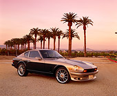 AUT 23 RK0697 04
1976 Datsun 280Z Green And Gold 3/4 Side View On Gravel By Palm Trees Filtered