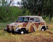 AUT 23 RK0751 01
1973 VW Thing 181 Camouflage 3/4 Front View In Field By Trees