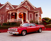 AUT 23 RK0811 02
1975 Chevrolet El Camino SS Red 3/4 Front View On Pavement By House