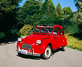 AUT 23 RK0848 02
1973 Citroen 2CV Red 3/4 Front View On Pavement By Trees Blue Sky