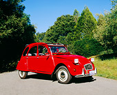 AUT 23 RK0849 01
1973 Citroen 2CV Red 3/4 Front View On Pavement By Trees Blue Sky