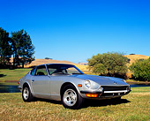 AUT 23 RK0860 04
1971 Datsun 240Z Silver 3/4 Front View On Grass By Water And Trees