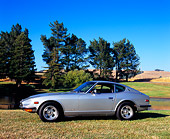 AUT 23 RK0861 01
1971 Datsun 240Z Silver 3/4 Front View On Grass By Water And Trees