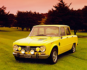 AUT 23 RK0866 02
1970 Alfa Romeo Giulia Super Yellow 3/4 Front View On Grass
