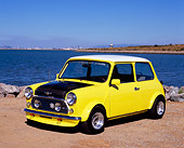 AUT 23 RK0868 04
1971 Austin Mini Cooper Racer Yellow 3/4 Front View On Dirt By Water