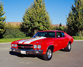 AUT 23 RK0880 02
1970 Chevrolet 454 Chevelle SS Hugger Orange White Stripes 3/4 Front View On Pavement By Trees