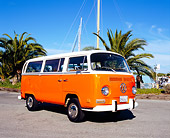 AUT 23 RK0961 01
1971 Volkswagen Bus Orange And White 3/4 Front View On Pavement By Palm Trees