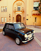 AUT 23 RK0983 01
1973 Austin Mini Black Checkered Top 3/4 Front View On Pavement By Building