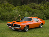 AUT 23 RK1122 01
1970 Mercury Cougar Eliminator Orange 3/4 Front View On Grass Trees Background