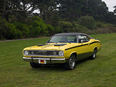 AUT 23 RK1125 01
1972 Plymouth Duster Yellow Front 3/4 Front View On Grass Trees Background