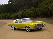 AUT 23 RK1130 01
1972 Chevrolet Monte Carlo Candy Lime Gold 3/4 Front View On Dirt Trees Background
