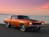 AUT 23 RK1162 01
1971 Chevrolet Monte Carlo Orange Black Stripe Low 3/4 Side View On Pavement