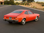 AUT 23 RK1580 01
1974 AMC Hornet Hatchback Red 3/4 Rear View On Pavement By Buildings Trees Dirt
