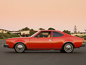AUT 23 RK1581 01
1974 AMC Hornet Hatchback Red Profile View On Pavement By Buildings Sky