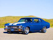 AUT 23 RK1604 01
1971 Chevrolet Nova Blue 3/4 Front View On Gravel By Hill Blue Sky