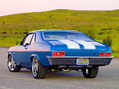 AUT 23 RK1611 01
1971 Chevrolet Nova Blue 3/4 Rear View On Gravel By Hill