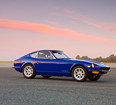 AUT 23 RK1649 01
1971 Datsun 240Z Blue 3/4 Front View On Pavement At Dusk