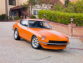 AUT 23 RK1654 01
1973 Datsun 240Z Orange 3/4 Front View On Driveway By House