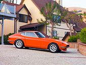 AUT 23 RK1655 01
1973 Datsun 240Z Orange 3/4 Front View On Driveway By House