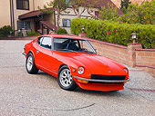 AUT 23 RK1671 01
1973 Datsun 240Z Red 3/4 Front View On Driveway By House