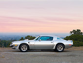AUT 23 RK1705 01
1975 Pontiac Firebird Trans Am Silver Profile View On Pavement