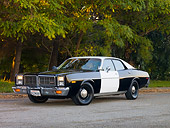 AUT 23 RK1727 01
1977 Dodge Monaco Black And White 3/4 Front View On Road By Trees