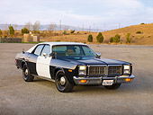 AUT 23 RK1731 01
1977 Dodge Monaco Black And White 3/4 Front View On Pavement By Hills