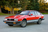 AUT 23 RK1736 01
1981 Alfa Romeo GTV6 Coupe Red 3/4 Front View On Pavement By Trees