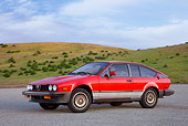 AUT 23 RK1739 01
1981 Alfa Romeo GTV6 Coupe Red 3/4 Front View On Pavement By Hills